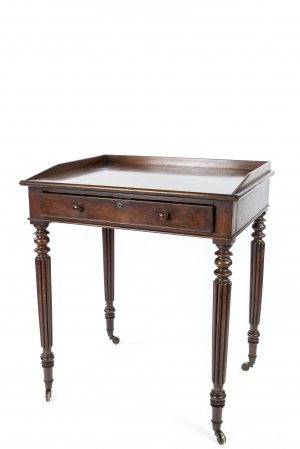 A REGENCY MAHOGANY WRITING TABLE ATTRIBUTED TO GILLOWS