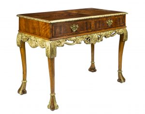 A George I Style Parcel Gilt Decorated Figured Walnut Two Drawer Side Table