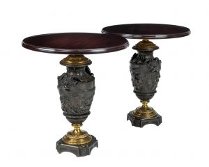 After Claude Michel Clodion, A Pair of Guilt Patinated Bronze Urns Converted to Occasional Tables