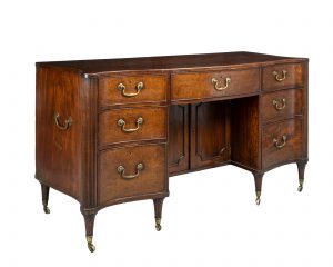 A Large Late 18th Century Hepplewhite Figured Mahogany Serpentine Kneehole Desk