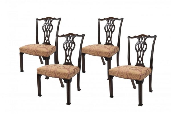 A Set of Four Carved Mahogany Chippendale Style Dining Chairs With Carved Splats by Gillows