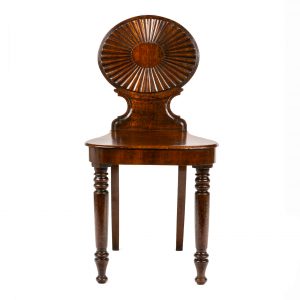 George III a pair of mahogany hall chairs attributed to Mayhew & Ince